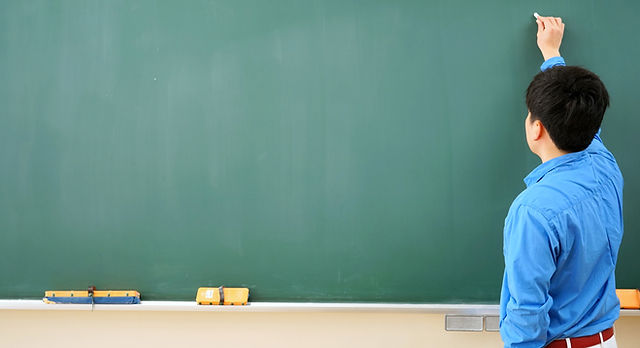 Teacher and Blackboard