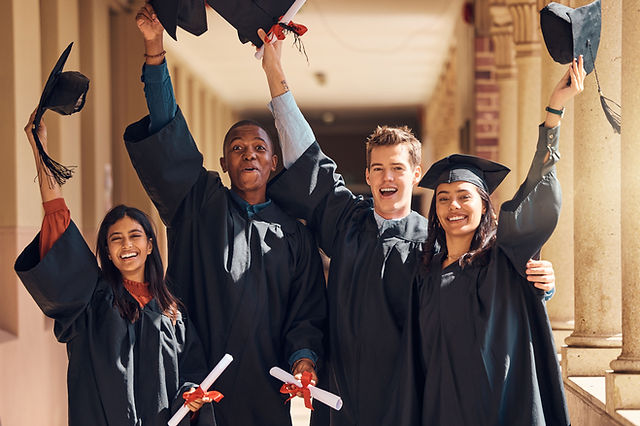 Graduates Holding Diplomas