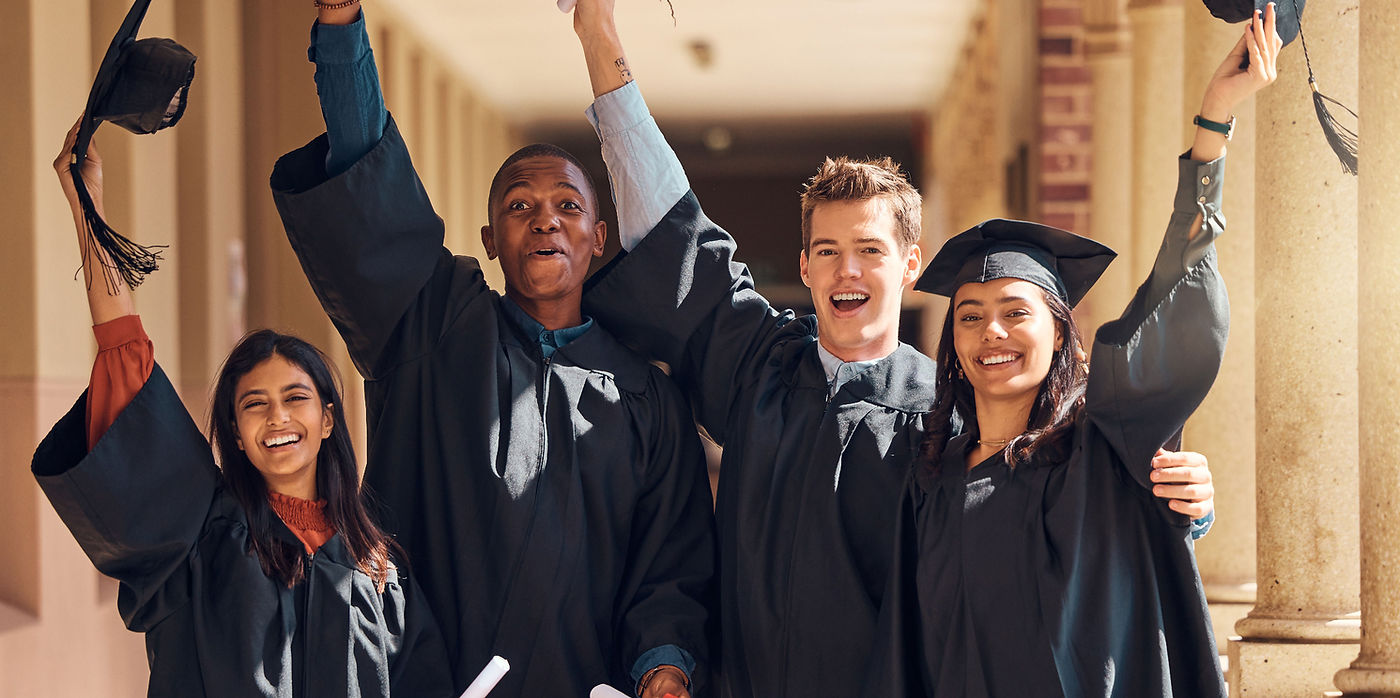 Graduates Holding Diplomas